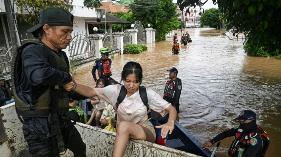 Boats carry terrified children to safety in Thai floods