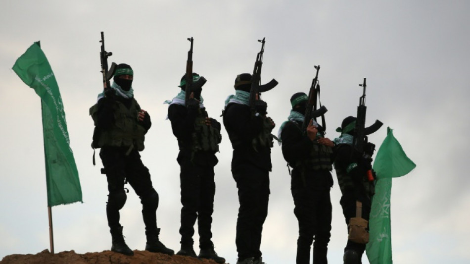 Hamas hands over dead Israeli hostages in black coffins