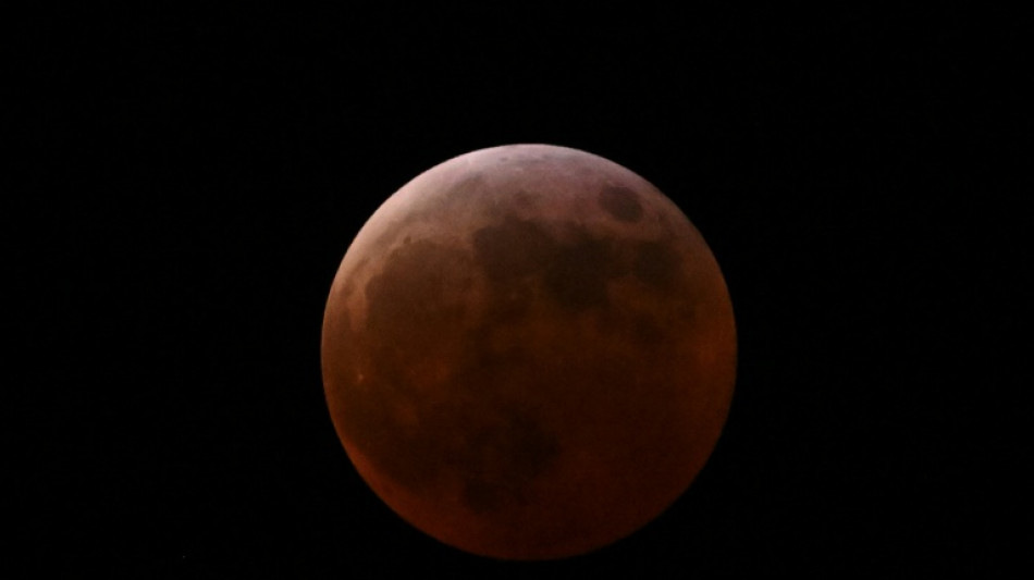 Stargazers marvel at 'Blood Moon', rare total lunar eclipse