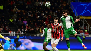 Feyenoord knock out 10-man AC Milan to reach Champions League last 16