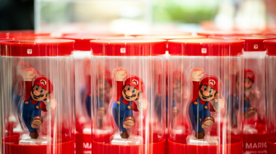 Nintendo lowers sales forecast as first-half profits plunge